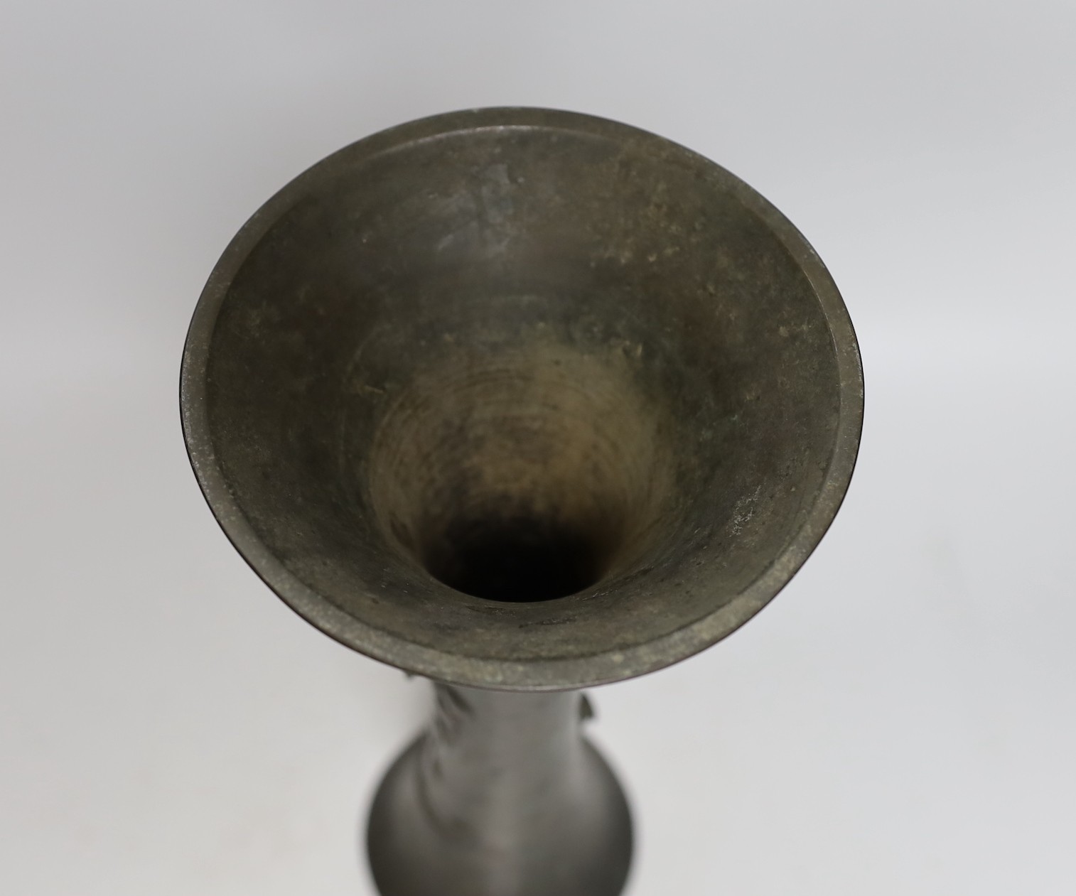 A Japanese bronze beaker vase, 19th century, with bee and vine decoration, 33cms high